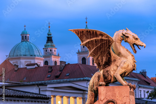 Dragon Bridge in Ljubljana, Slovenia with dragon statue at night