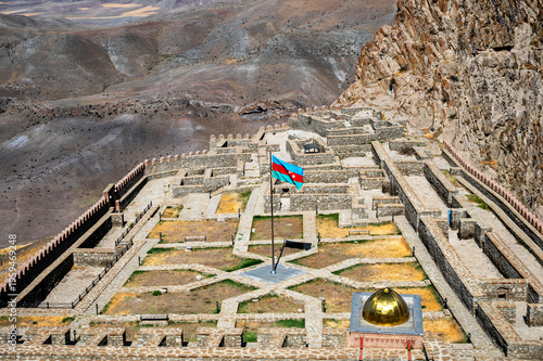 Alinja Castle standing on mountain with Azerbaijan flag waving