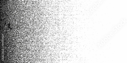 Abstract grainy texture transitions from dark to light with speckles