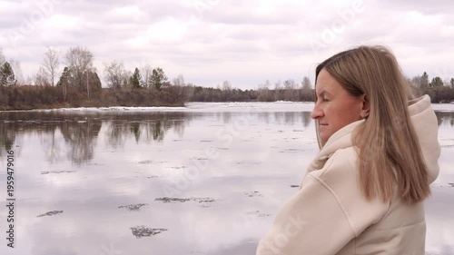 Emotional loneliness woman observing cold landscape quiet reflection and solitude Cold atmosphere surrounds female figure cold mood expresses isolation introspection and peaceful winter contemplation