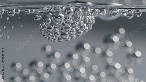 Bubbles Rising and Breaking Surface of Water in Macro Photography Capturing the Motion and Texture of Liquid Elements