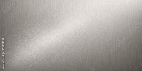 A sleek brushed metal background features a silver metallic texture on a shiny stainless steel plate surface with a light grey pattern for a modern industrial backdrop material
