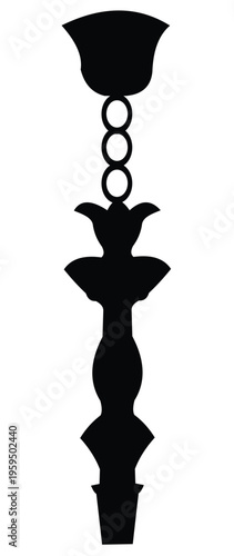 Black silhouette of an ornate object with circles