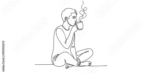 A man sits cross-legged, enjoying a hot beverage from a mug, with steam rising to indicate warmth and comfort.