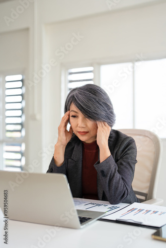 Business, headache and woman in office, laptop and tired with fatigue, exhausted. Stress, person and employee in workplace. migraine with anxiety, pressure and bankruptcy