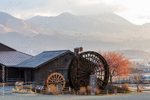 Photos Traditional water wheel at Asobo no Sato Kugino Roadside Station with Mount Aso mountains in the background, Kyushu, Japan