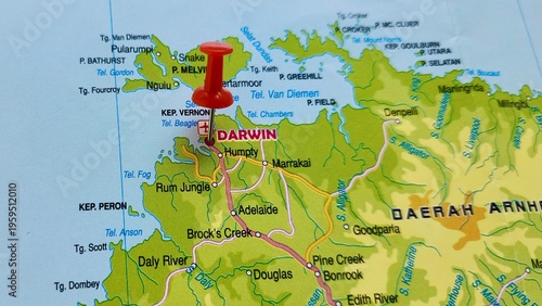 View of Darwin, is the capital city of the Northern Territory, Australia, on a geographical map of Australia and New Zealand, marked with red pushpin