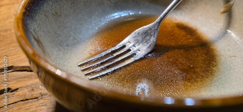 an empty, dirty plate with sauce residue