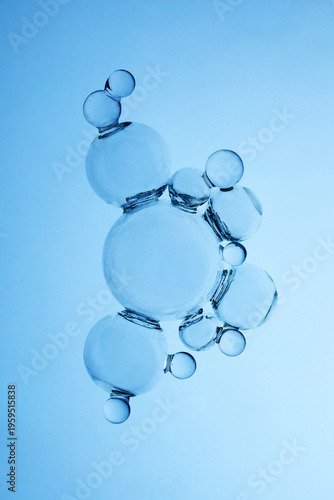 Abstract cosmetic lab. Water bubbles forming molecular structure on blue background