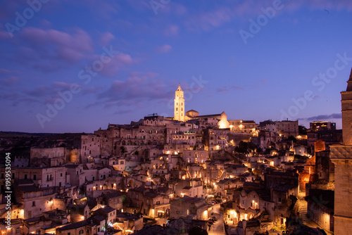 Photos Matera in the blue hour, when the Sassi glow softly beneath a deepening southern sky