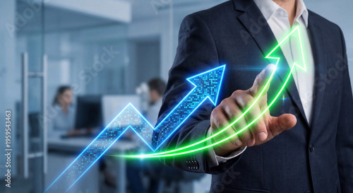 Businessman in a suit pointing at glowing upward arrows in the office