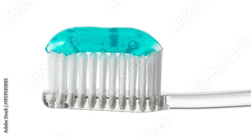 Close-up of a toothbrush with toothpaste applied, ready for brushing teeth
