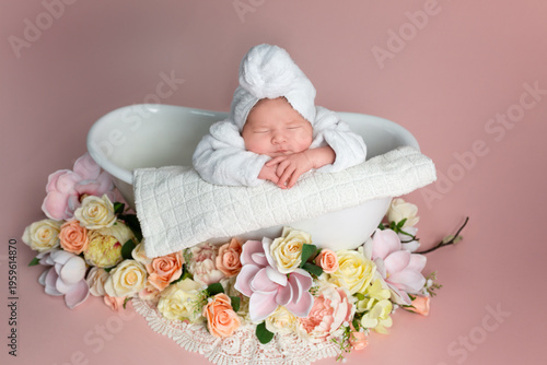 Sweet Newborn Baby in Bathtub with Flowers