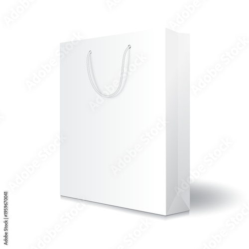 Realistic white paper bag mockup with white rope handles. Blank shopping bag isolated on white background with soft shadow. Minimalist illustration for premium packaging design and store.