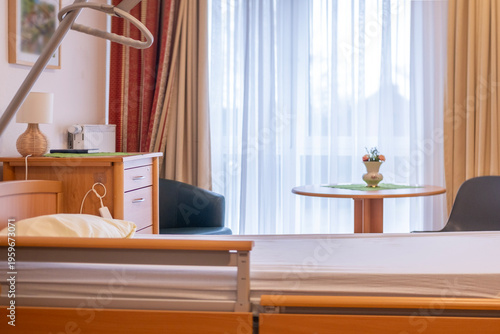 Fotografía Modern medical bed in hospital, nursing home bed with wooden frame, adjustable m