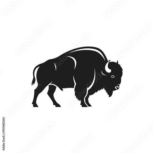 Black silhouette of a bison walking.
