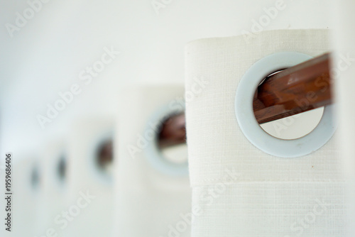 Curtain Details: A close-up showcases the elegant details of curtains, highlighting their crisp fabric and the wooden rod they hang from. This image is a celebration of interior design and home decor.