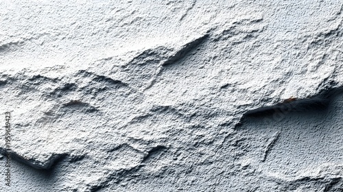 A close-up view of a rough textured gray stone surface