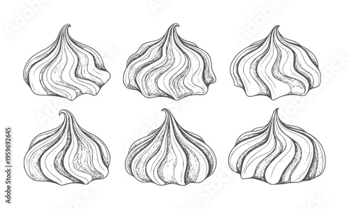 Six hand drawn meringue cookies arranged in two rows white sweet dessert food