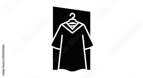 Graduation gown hanging on door, symbolizing achievement and celebration.
