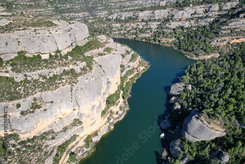Aerial view of Margalef reservoir on sunny winter day. Tarragona Province, Spain.