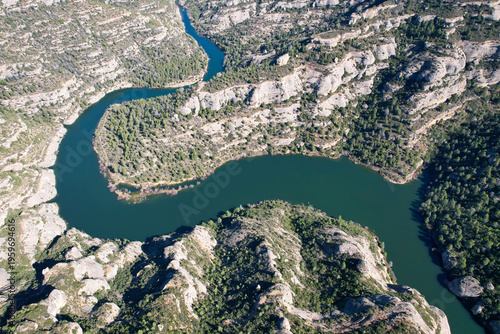 Bird's eye view of Margalef reservoir on sunny day. Tarragona Province, Spain.