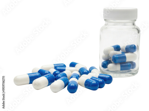 Blue and white capsules in a clear bottle isolated, medication pills for healthcare and pharmaceutical use on no background