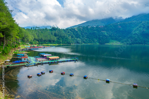 Menjer or Menjer Lake, located in Wonosobo,Central Java, Indonesia. Besides being a tourist attraction,this lake also functioned as a hydroelectric power plant or PLTA. Forest and lake in foggy.