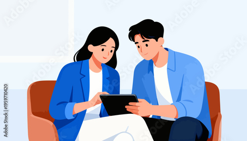 Two people share a tablet on a cozy couch. They look engaged, smiling softly at the screen. Their hands hold the device together. The scene suggests collaboration or shared learning