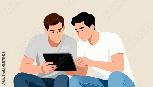 Two young men sit closely, sharing a tablet. They look focused, engaged in conversation. Their hands guide the screen, showing interest. Ideal for teamwork or learning scenes