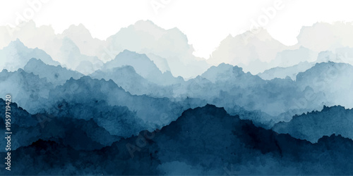 A serene morning landscape of misty blue mountain peaks rising above a high alpine valley as the sunrise breaks through clouds and fog over a snow-capped range