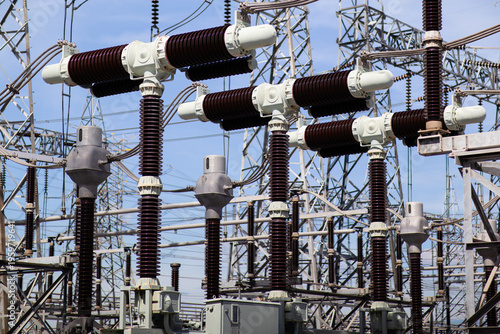 Obraz na płótnie High-voltage disconnect switches in an electrical substation support power transmission, grid reliability, and utility infrastructure for safe switching and industrial energy operations