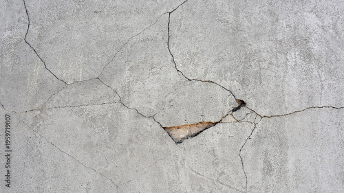 old plaster on the wall, cement, adhesive for screed. the old clay wall is crumbling. surface wall for vintage background. Wall texture, cracked plaster, grey cement floor, needs repair, restoration