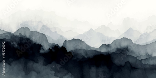 Misty morning panorama of the blue Alps peaks emerging from the fog and clouds over a mountain valley at dawn