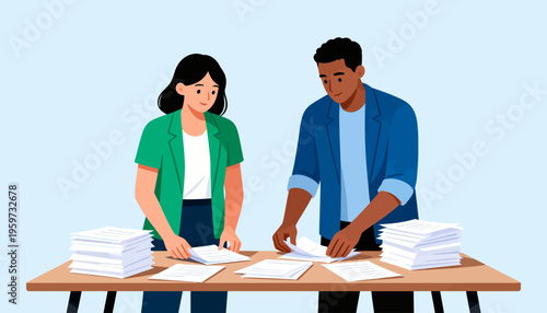 Two people sit at a table with piles of documents. They appear focused, organizing paperwork together. The scene suggests teamwork or administrative work. It could fit for business, education