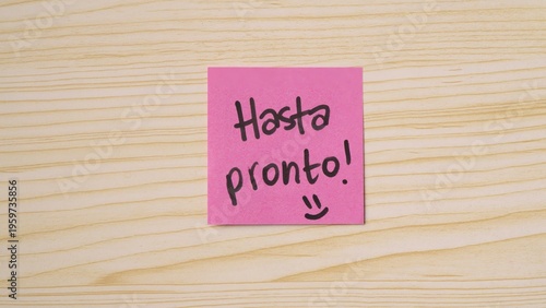 Positive Handwritten “Hasta Pronto!” message on sticky note. Positive Handwritten “Goodbye!” message on sticky note.