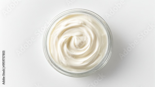 Top view of sour cream in a glass bowl isolated on white background