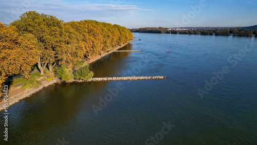Obraz na plátně Rock breakwaters in the river Rhine in Germany, seen from above