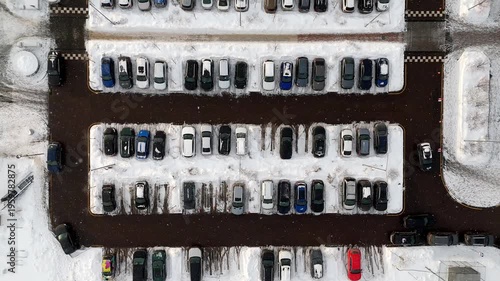 Car parking in winter top view. Parking in the snow is hard to park a car. High quality 4k footage