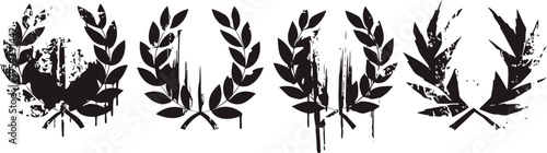 Set of four grunge laurel wreath designs with distressed texture and varying leaf shapes