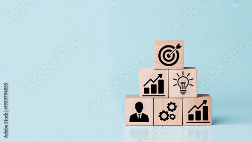 Business growth concept with wooden blocks showing target analytics strategy icons on blue background 