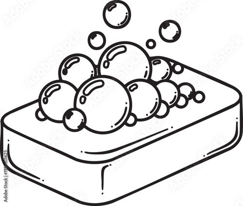 Soap bubbles overflowing from a rectangular soap bar outdoors