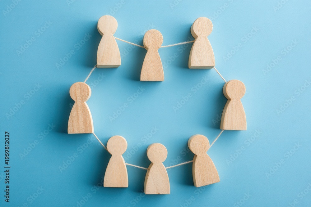 Obraz premium Connected Circle: A symbolic representation of interconnectedness and collaboration, with wooden figures forming a seamless circle, emphasizing unity and shared purpose.
