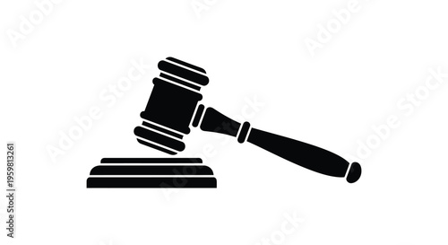 Black gavel resting on a sound block a justice symbol silhouette