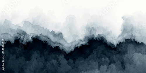 A breathtaking winter landscape of high snow-covered mountains features jagged rock peaks and a cold glacier under a cloudy sky with mist drifting over the summit of the Alps