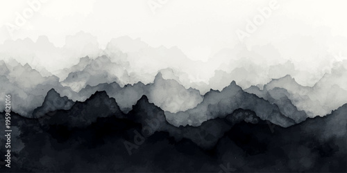 An aerial view of the misty mountain landscape captures a snow capped summit and forest valley under a sunset sky filled with clouds and fog