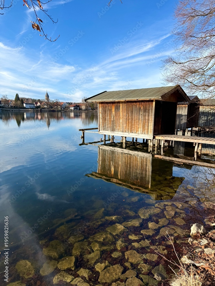 Fototapeta premium old wooden boat houses on the idyllic lake