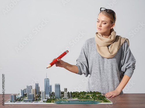 Φωτογραφία A 25-year-old Caucasian female architect draws a watercolor city model, pen drawing, at a studio table in a quiet space, focused on her work
