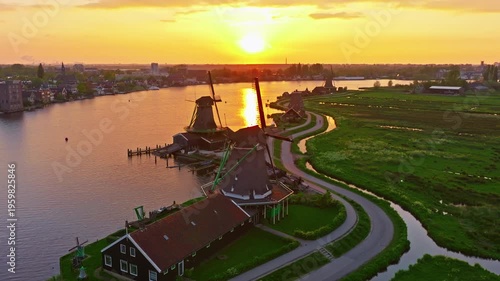 Aerial view of windmills at famous tourist site Zaanse Schans in Holland on sunset. Zaandam, Netherlands