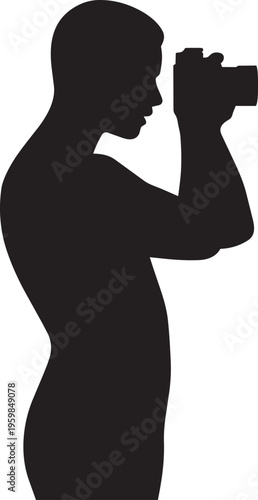 Silhouette of a person holding a camera and looking through the viewfinder, side view